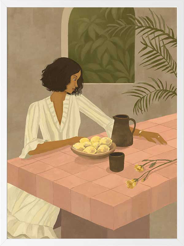 A woman sits beside a plate of lemons on a soft pink tiled table in a quiet interior. From the Lounging Ladies II collection by Urban Road.