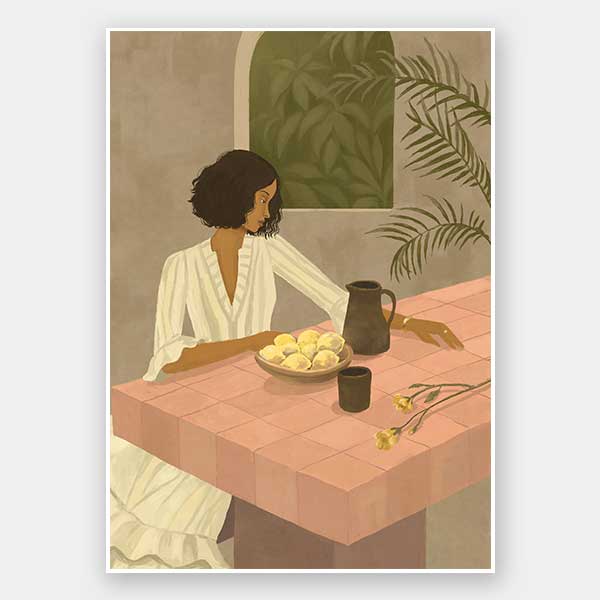 A woman sits beside a plate of lemons on a soft pink tiled table in a quiet interior. From the Lounging Ladies II collection by Urban Road.