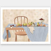 A wooden chair and table are set with pears, peaches, and plums over soft blue and cream linens. From the Lounging Ladies II collection by Urban Road.