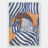 Woman in striped sleepwear reclines across soft blue and neutral bedding in a quiet personal scene, from the Lounging Ladies II collection by Urban Road.