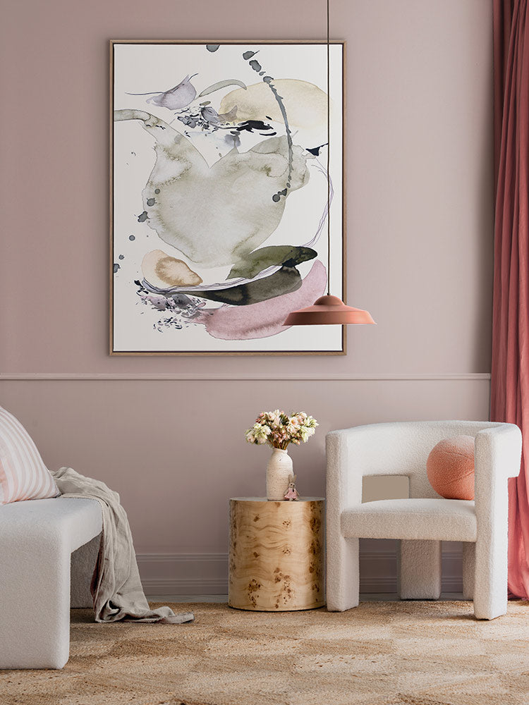 Forest Light abstract artwork against a blush wall styled with white and neutral furniture, checkered rug and pink curtains.