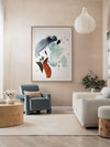 Rainwater abstract artwork hanging above blue and green armchairs, styled with neutral decor, orange curtains and kids toys.