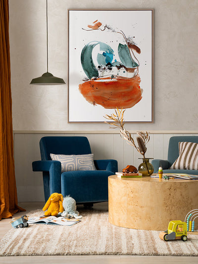 Self Stabilising abstract art styled with armchairs and round timber coffee table in a colourful, light-filled living room.