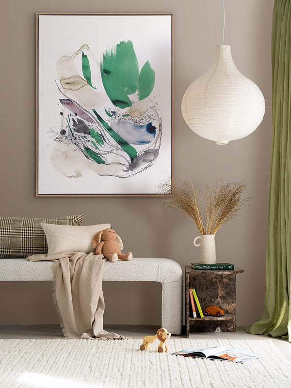 Unanticipated abstract art print styled in a cosy kids room with neutral decor, green curtains, white rug and pendant light.