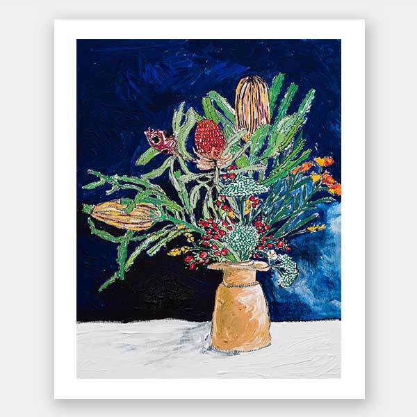 The Australian Wildflower Bouquet Unframed Art Print by Urban Road features a vibrant arrangement of textured Australian natives and greenery in a vase, set against a deep blue background with a white surface beneath.
