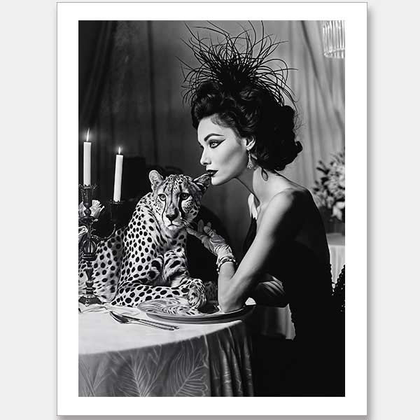 A glamorous woman in an elegant dress and feathered headpiece sits beside a calm cheetah. The Feline Couture Unframed Art Print by Shaynna Blaze x Urban Road brings vintage black-and-white allure to your wall art collection.