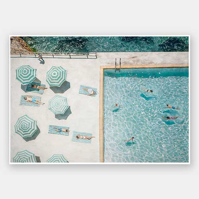 Aerial view of swimmers and sunbathers under green-and-white umbrellas—ideal for fans of vintage Bondi Beach style, the Bondi Bathers Club Unframed Art Print by Shaynna Blaze x Urban Road brings classic coastal charm to any space.