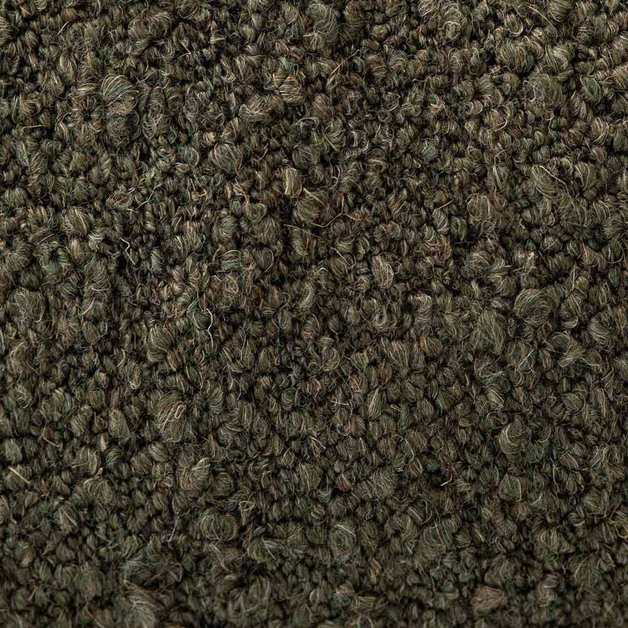 The Urban Road Virella Rectangle Green Cushion (90x30cm) is a luxury dark green cushion with a textured finish and slightly pointed corners, perfect for elevating any interior design. Shown on a white background.