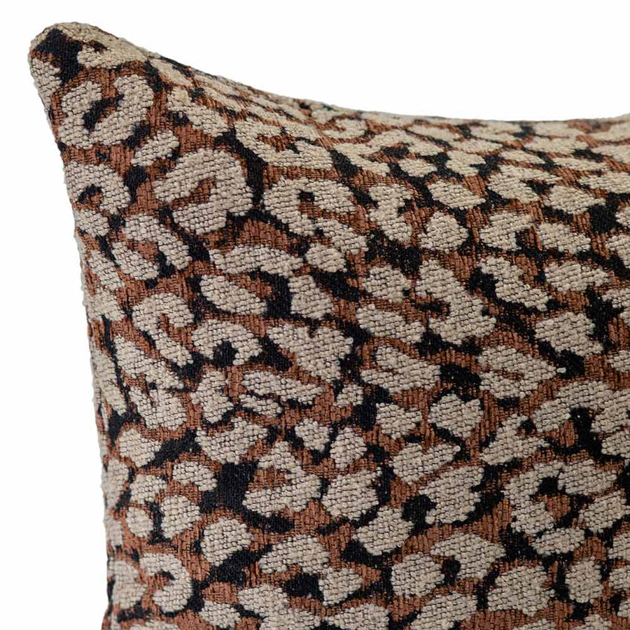 The Urban Road Foxshade Square Rust Cushion (50x50cm) features a luxury woven fabric with a brown, beige, and black abstract animal print, perfect for adding Darren Palmer-inspired style to your space. Shown against a white background.