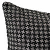 The Noirstone Lumbar Black-and-White Cushion by Urban Road (50x30cm) features a houndstooth pattern, ideal for enhancing interiors. Inspired by Darren Palmer and displayed on a crisp white background.