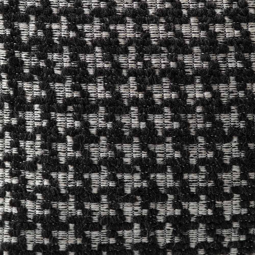 The Urban Road Noirstone Square Black-and-White Cushion (50x50cm) features tightly woven fabric and slightly rounded corners—an ideal luxury accent for contemporary interiors.
