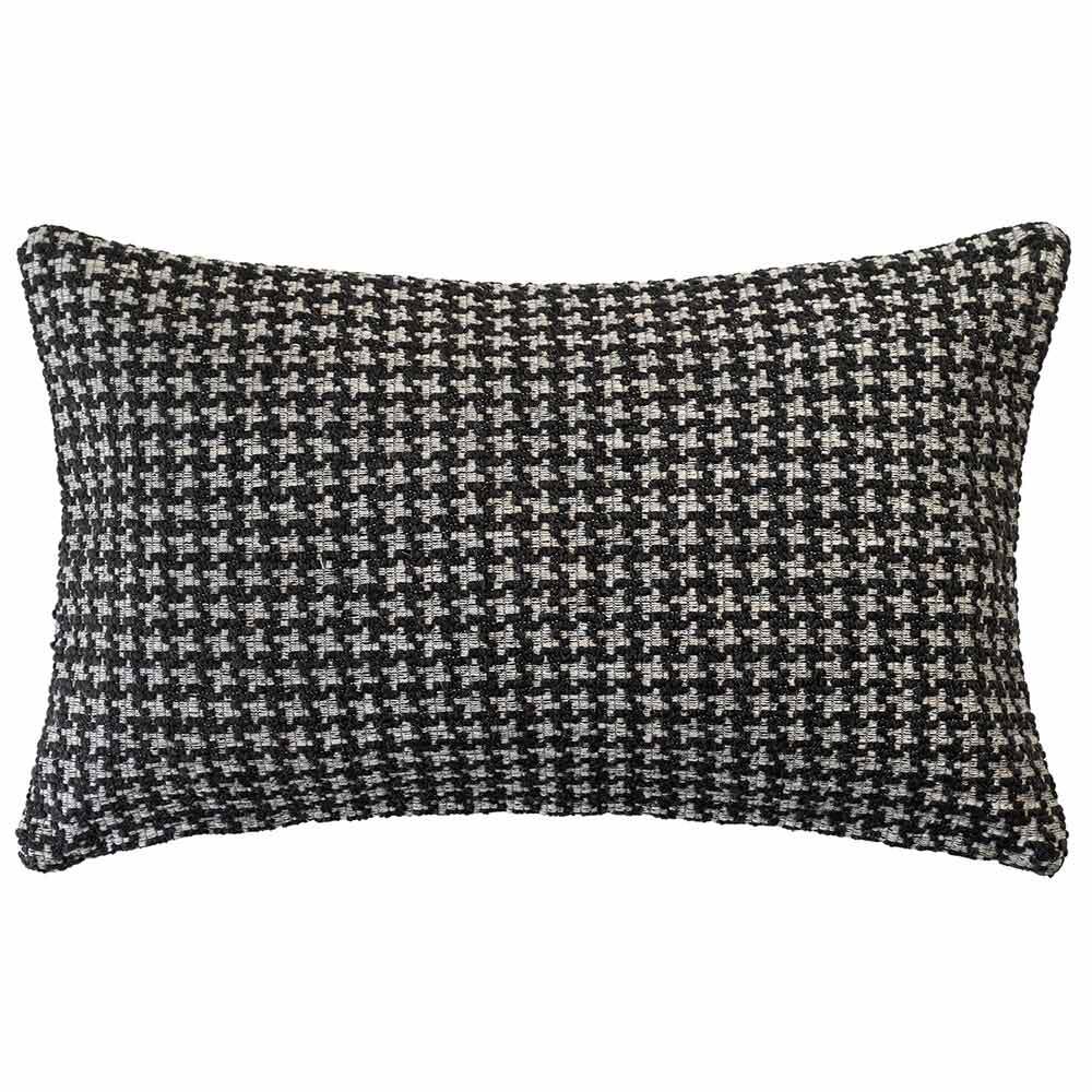 The Noirstone Lumbar Black-and-White Cushion by Urban Road (50x30cm) features a houndstooth pattern, ideal for enhancing interiors. Inspired by Darren Palmer and displayed on a crisp white background.
