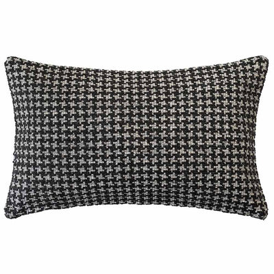 The Noirstone Lumbar Black-and-White Cushion by Urban Road (50x30cm) features a houndstooth pattern, ideal for enhancing interiors. Inspired by Darren Palmer and displayed on a crisp white background.