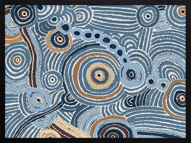 Concentric circle motifs and flowing white dot patterns in navy blue, sky blue, and ochre against a textured pale blue background. From the Maria Watson-Trudgett collection with Urban Road.