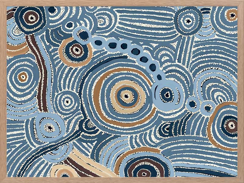 Concentric circle motifs and flowing white dot patterns in navy blue, sky blue, and ochre against a textured pale blue background. From the Maria Watson-Trudgett collection with Urban Road.