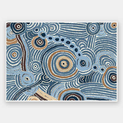 Concentric circle motifs and flowing white dot patterns in navy blue, sky blue, and ochre against a textured pale blue background. From the Maria Watson-Trudgett collection with Urban Road.