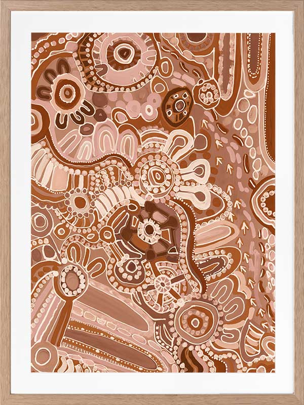 Lively artwork with pink and brown circular motifs, radiating forms, and decorative detailing over a warm clay background. From the Maria Watson-Trudgett collection with Urban Road.