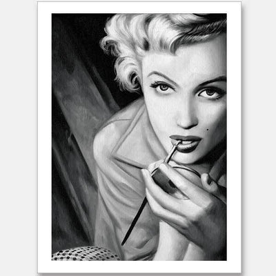 The Marilyn Mono Unframed Art Print by Urban Road features a monochromatic illustration of a woman with short, wavy blonde hair and a beauty mark, applying lipstick in an iconic Marilyn Monroe style.