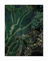 The Tranquility Unframed Art Print by Urban Road features an aerial view of rice terraces and lush green fields, with winding paths and dense tropical trees creating vibrant, natural patterns across the landscape.