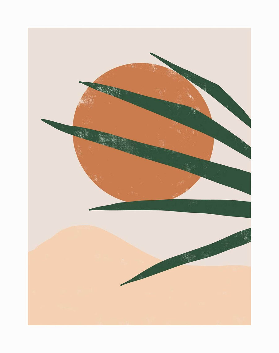 The Sun Baked Unframed Art Print by Urban Road features a large orange sun, beige backdrop, flowing sand dunes, and green palm leaves on the right, all in a muted palette for a vintage desert-inspired look.