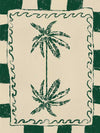 Playful palm tree illustration in green on a beige background with striped and wavy border accents, from the Shatha collection with Urban Road.