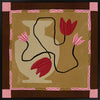 Abstract floral composition with red blooms on black curving stems over a camel and brown patchwork base, framed in soft pink, from the Shatha collection with Urban Road.