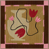 Abstract floral composition with red blooms on black curving stems over a camel and brown patchwork base, framed in soft pink, from the Shatha collection with Urban Road.