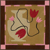 Abstract floral composition with red blooms on black curving stems over a camel and brown patchwork base, framed in soft pink, from the Shatha collection with Urban Road.