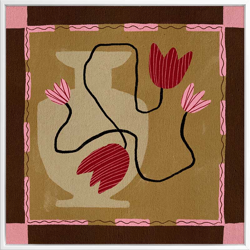 Abstract floral composition with red blooms on black curving stems over a camel and brown patchwork base, framed in soft pink, from the Shatha collection with Urban Road.