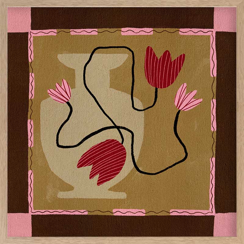 Abstract floral composition with red blooms on black curving stems over a camel and brown patchwork base, framed in soft pink, from the Shatha collection with Urban Road.