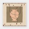 Minimalist floral artwork featuring a pale peach vase with stylised red blooms and slender stems on a beige and taupe backdrop, from the Shatha collection with Urban Road.