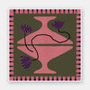 Bold artwork featuring a vibrant pink vase with purple blooms and a pink striped border on a green background, from the Shatha collection with Urban Road.