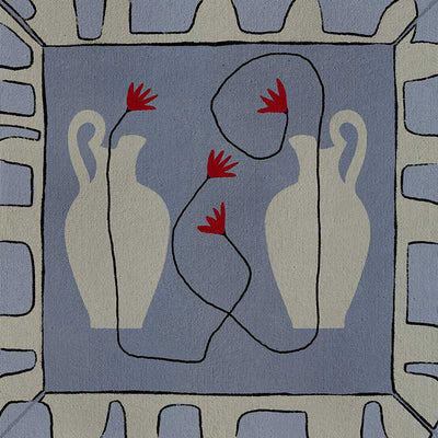 Duo of pale blue vases with bright red flowers, arranged over a denim-toned background and framed in blue and white block patterning, from the Shatha collection with Urban Road.