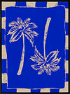 Vibrant coastal-inspired artwork featuring two cream palm trees with sweeping fronds on a bold cobalt blue background with a striped border, from the Shatha collection with Urban Road.