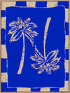 Vibrant coastal-inspired artwork featuring two cream palm trees with sweeping fronds on a bold cobalt blue background with a striped border, from the Shatha collection with Urban Road.