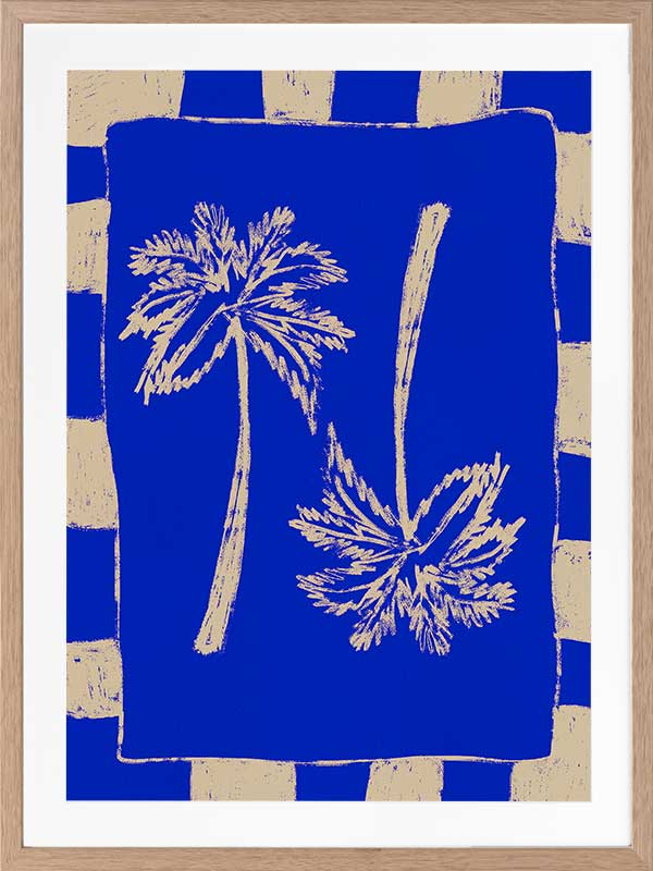 Vibrant coastal-inspired artwork featuring two cream palm trees with sweeping fronds on a bold cobalt blue background with a striped border, from the Shatha collection with Urban Road.