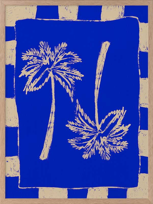 Vibrant coastal-inspired artwork featuring two cream palm trees with sweeping fronds on a bold cobalt blue background with a striped border, from the Shatha collection with Urban Road.