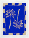 Vibrant coastal-inspired artwork featuring two cream palm trees with sweeping fronds on a bold cobalt blue background with a striped border, from the Shatha collection with Urban Road.