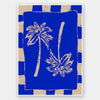 Vibrant coastal-inspired artwork featuring two cream palm trees with sweeping fronds on a bold cobalt blue background with a striped border, from the Shatha collection with Urban Road.