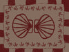 Mirrored burgundy seashell design with curved botanical accents, set on a brown background with a bold burgundy striped border, from the Shatha collection with Urban Road.