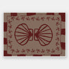 Mirrored burgundy seashell design with curved botanical accents, set on a brown background with a bold burgundy striped border, from the Shatha collection with Urban Road.