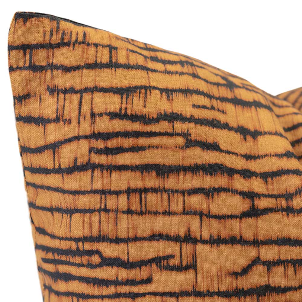 Cushion from the Tim Neve collection by Urban Road, featuring a golden bark-like linear pattern on a deep charcoal background.