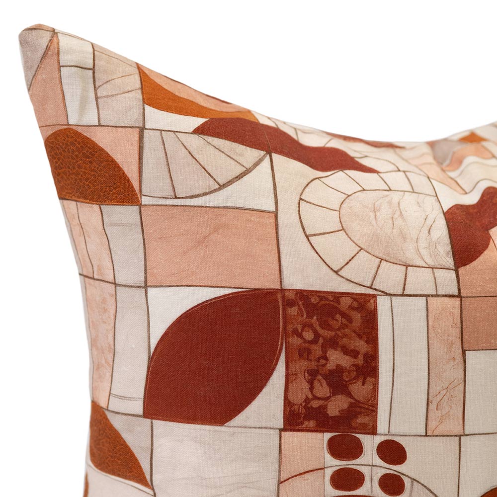 Cushion from the Tim Neve collection by Urban Road, with a patchwork of soft organic shapes in warm earthy tones.