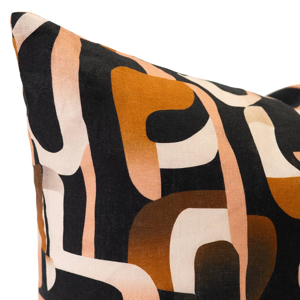 Cushion from the Tim Neve collection by Urban Road, showcasing bold black and brown abstract lines over a neutral base.