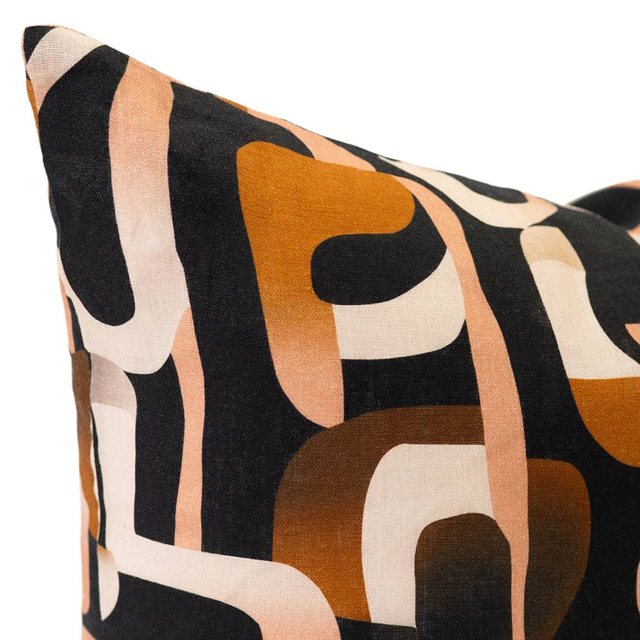 Cushion from the Tim Neve collection by Urban Road, showcasing bold black and brown abstract lines over a neutral base.