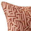 Cushion from the Tim Neve collection by Urban Road, with an intricate terracotta maze pattern on a warm brown background.