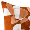 Cushion from the Tim Neve collection by Urban Road, featuring a golden patchwork design with organic curved shapes in neutral hues.