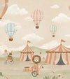 Pastel circus fair with hot air balloons, striped tents and playful animal performers, from the Little Tails Collection by Urban Road.