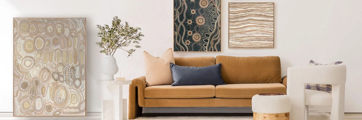 Modern lounge room featuring authentic Aboriginal art, intricate patterns, earthy tones, and a contemporary sofa setting.
